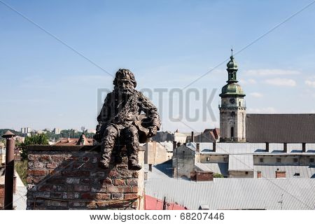 Chimneysweep Monument On The Roof In The Lviv, Ukraine.