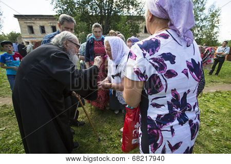 KRASNY BRONEVIK, RUSSIA - JULY 7, 2014: Celebrations commemorating the Rev. Anthony Dymsky (died 1224) in Antony Dymsky Monastery - Procession on Lake Dymsky, the great blessing of water and bathing.