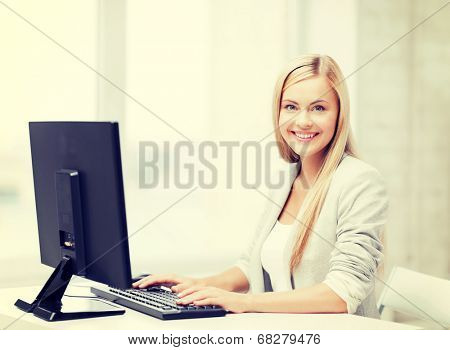 picture of smiling businesswoman using her computer