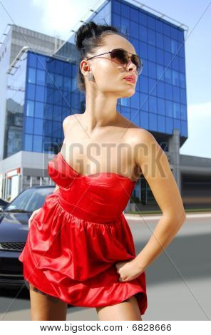 Independent Brunette In Sunglasses On Street