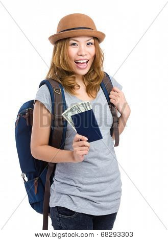Happy woman with passort and cash