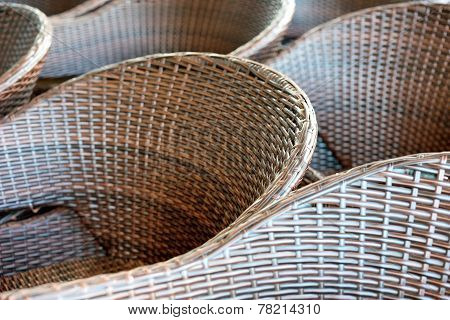 Diagonal Lines And Rattan Armchairs