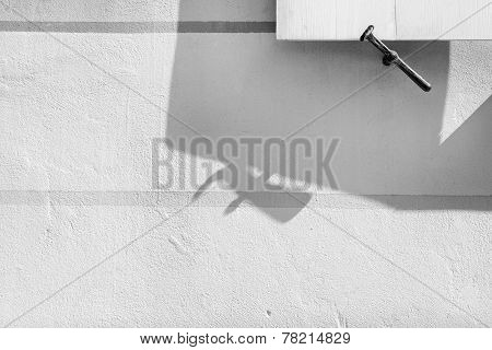 Detail Of Shutters On The Window With The Shadow On The Wall