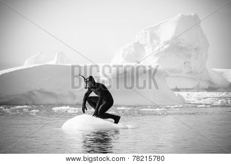 A diver on the ice against the blue iceberg. Antarctica
