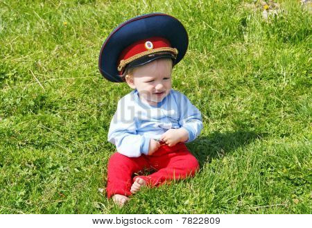 The child on a green lawn