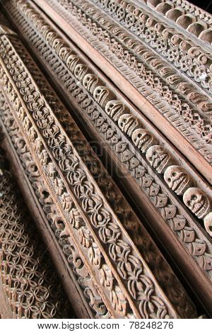 KATHMANDU, NEPAL - APRIL 2014 : Details of wooden entrance carved in skulls and other patterns at Hanuman Dhoka, Old Royal Palace in Kathmandu, Nepal on 12 April 2014. 