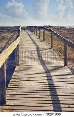 Wooden bridge on the ocean in Costa Nova, Portugal