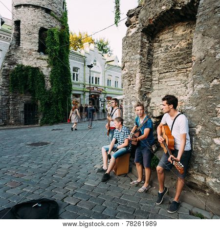 Street Musicians At The Evening Near Famous Viru Gate In Old Town Tallinn