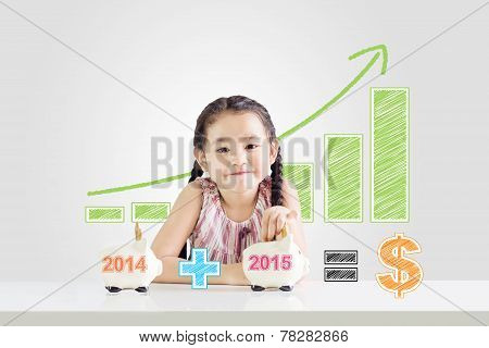 Little Girl Putting Money On A Piggy Bank With A New Year 2015.saving Concept From 2014 Until 2015