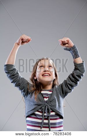 Little Girl Exulting Raising Her Arms