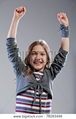 Little Girl Exulting Raising Her Arms