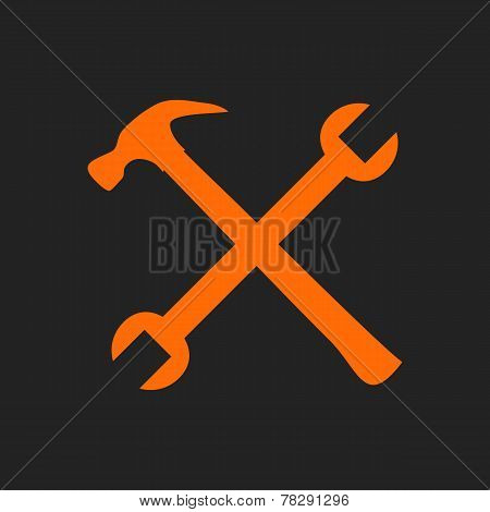 Crossed orange tools on black