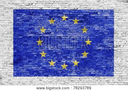Flag Of European Union Over White Brick Wall