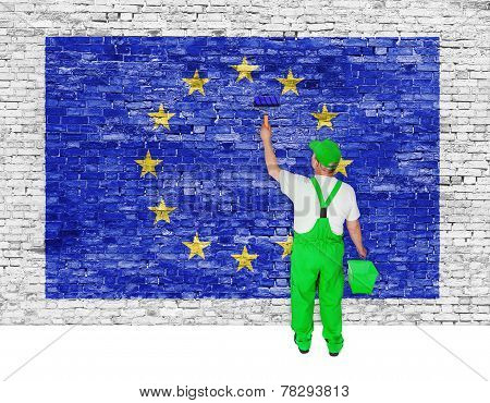 Painter Covers Brick Wall With Flag Of European Union