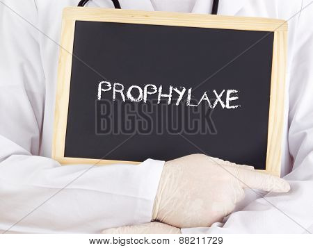 Doctor Shows Information On Blackboard: Prophylaxis In German