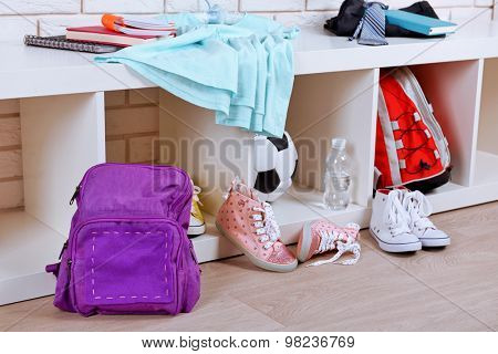 Children things stacked in room