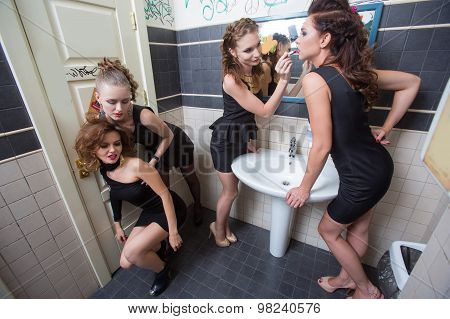 drunk girl in toilet bars. women in evening dresses in alcoholic intoxication