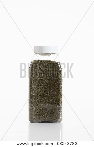 Majoram In Clear Container On White Background