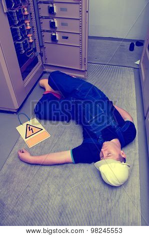 electrician electrocuted - wounded man lying on the ground