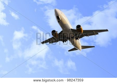 Commercial Flight Airplane Flying On Blue Sky In Travel Tourism Concept