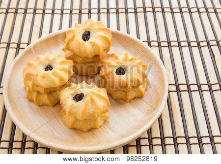 Cookies In Wooden Plate On Wood Table