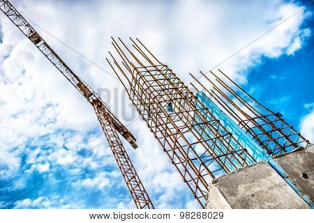 Concrete Pillars On Industrial Construction Site. Building Of Skyscraper With Crane, Tools