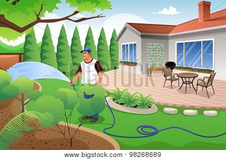 Man Watering His Grass And Garden