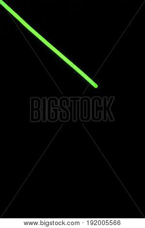 Glow sticks neon light fluorescent on back background. variation of different colored chem lights