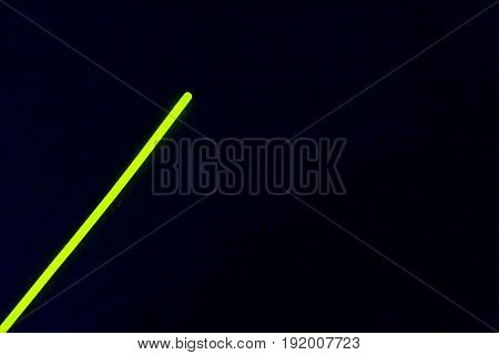 Glow sticks neon light fluorescent on back background. variation of different colored chem lights