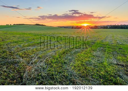 Sunset At Cultivated Land In The Countryside On A Summer.
