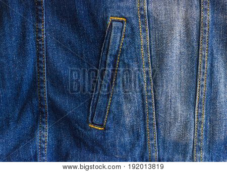 Pocket of a worn denim jacket. The pocket of the jacket is large-sized on a denim women`s jacket.