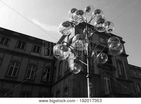 a lantern with many lamps on a sunny day