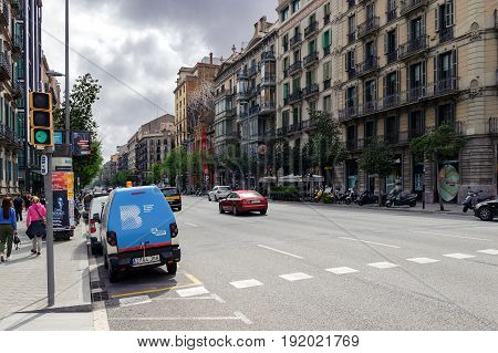 BARCELONA, SPAIN - MAY 2017: Street of Barcelona town with transport and traditional catatonia architecture