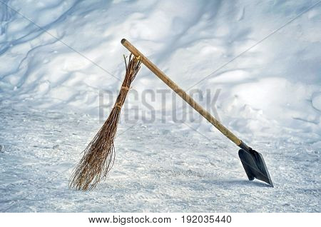 Chihowie broom and shovel in the snow