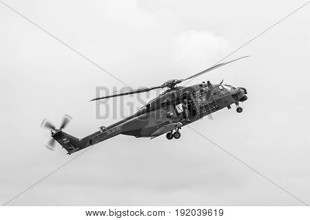 BERLIN GERMANY - JUNI 01 2016: Flight helicopter NH90 of the German Army. Black and white. Exhibition ILA Berlin Air Show 2016
