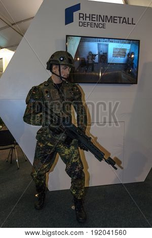 BERLIN GERMANY - JUNE 01 2016: The stand of Rheinmetall Defence. Modern equipment a soldier of the German army (Bundeswehr). Exhibition ILA Berlin Air Show 2016.