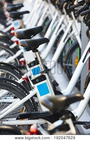 Eco-friendly urban transport. Electric bikes charging batteries. Environmental protection