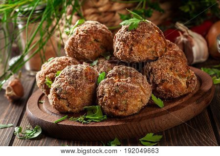 Stack Of Baked Meatballs On A Chopping Board