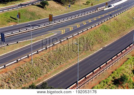 Morning landscape close up of empty M41 freeway with on and off ramps passing through Mhlanga ridge in Durban South Africa