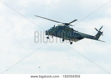 BERLIN GERMANY - JUNE 02 2016: Helicopter NH90 of the German Army. Demonstrative performance. Exhibition ILA Berlin Air Show 2016