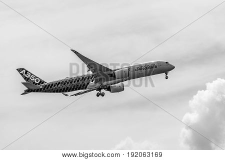 BERLIN GERMANY - JUNE 02 2016: Demonstration flight Airbus A350 XWB. Black and white. Exhibition ILA Berlin Air Show 2016