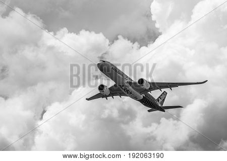 BERLIN GERMANY - JUNE 02 2016: Demonstration flight Airbus A350 XWB. Black and white. Exhibition ILA Berlin Air Show 2016