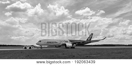 BERLIN GERMANY - JUNE 02 2016: The newest Airbus A350 XWB at the airfield. Black and white. Exhibition ILA Berlin Air Show 2016