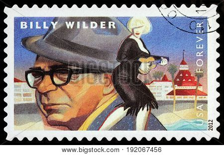 LUGA RUSSIA - APRIL 26 2017: A stamp printed by USA shows famous American producer Billy Wilder and Marilyn Monroe starring in romantic comedy film Some Like It Hot circa 2012
