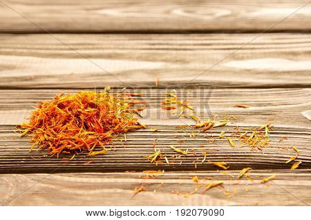 Spice saffron on the wooden table. Close-up.
