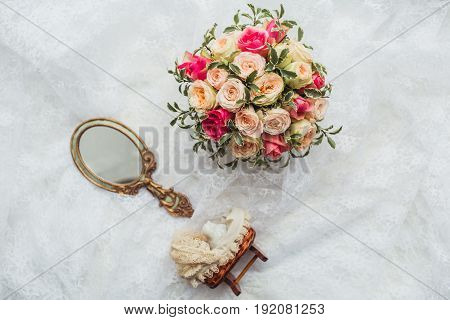 Luxury shoes and bride jewel mirror on the sofa
