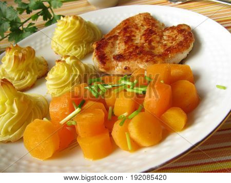 Homemade chicken steak with carrots and dutchess potatoes