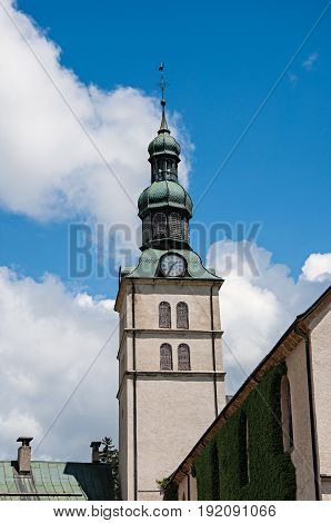 Bellow tower in Megève, French Alps, alpine landscape, blue sky with clouds