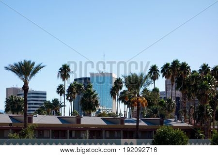 Downtown of a major Arizona city of Tucson full of high rise office buildings; back lit shot.