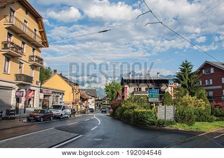 Saint-Gervais-Les-Bains, France - June 25, 2016. Street with cars and shops in the district of Le Fayet, a famous ski resort located in Haute-Savoie Province, near the Mont Blanc in the French Alps